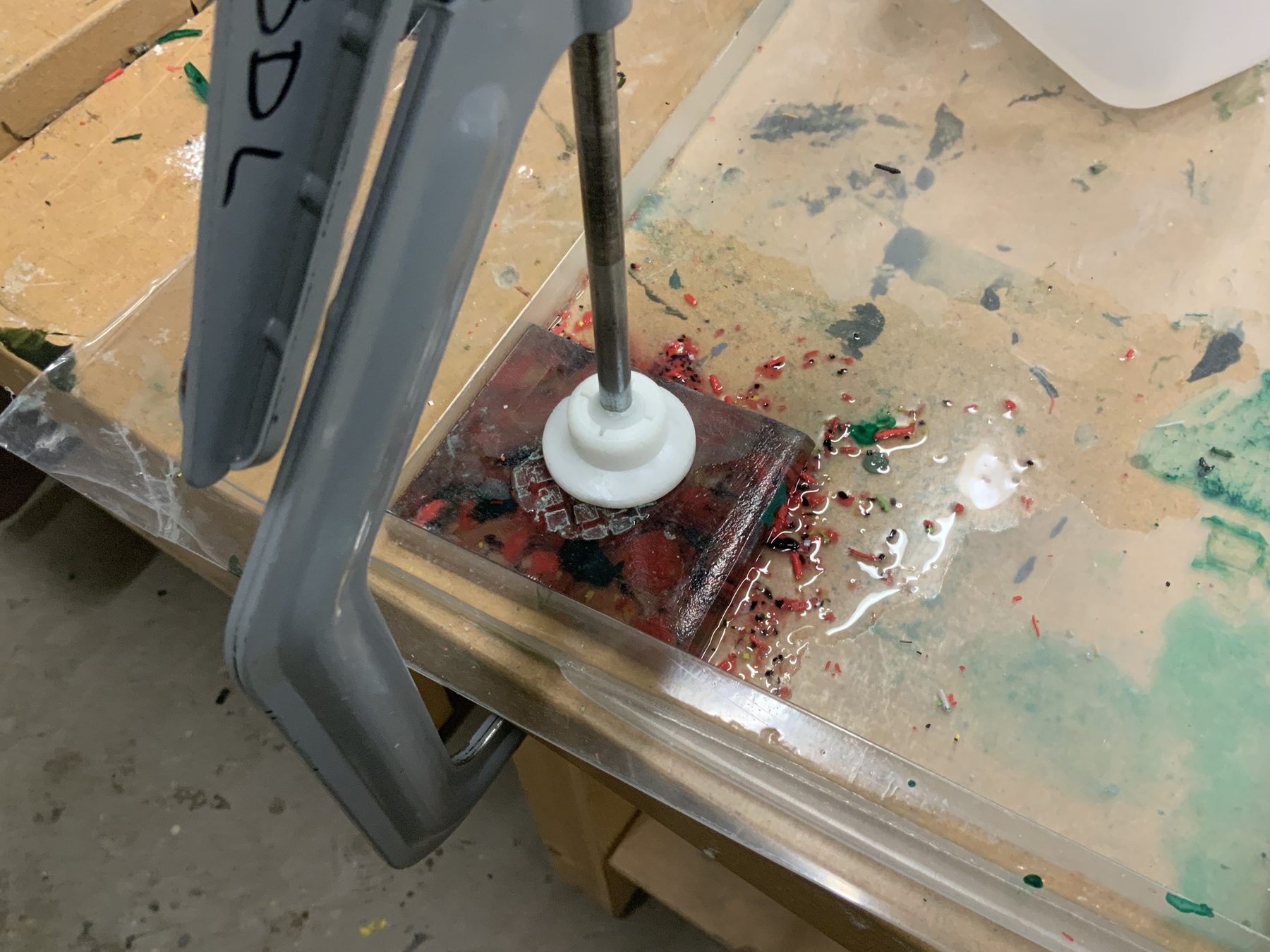 Breaking down acetate chips in the workshop